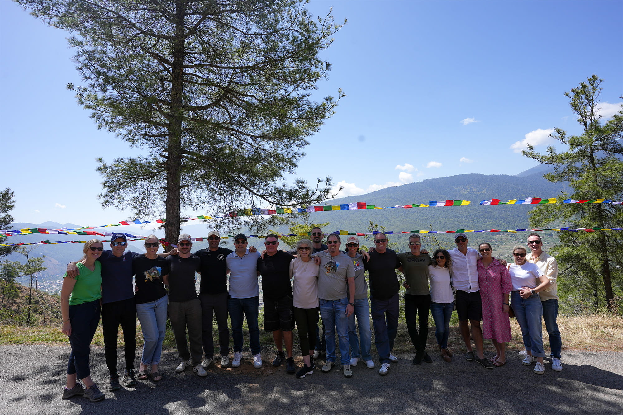 Corporate group with prayer flags in the backdrop